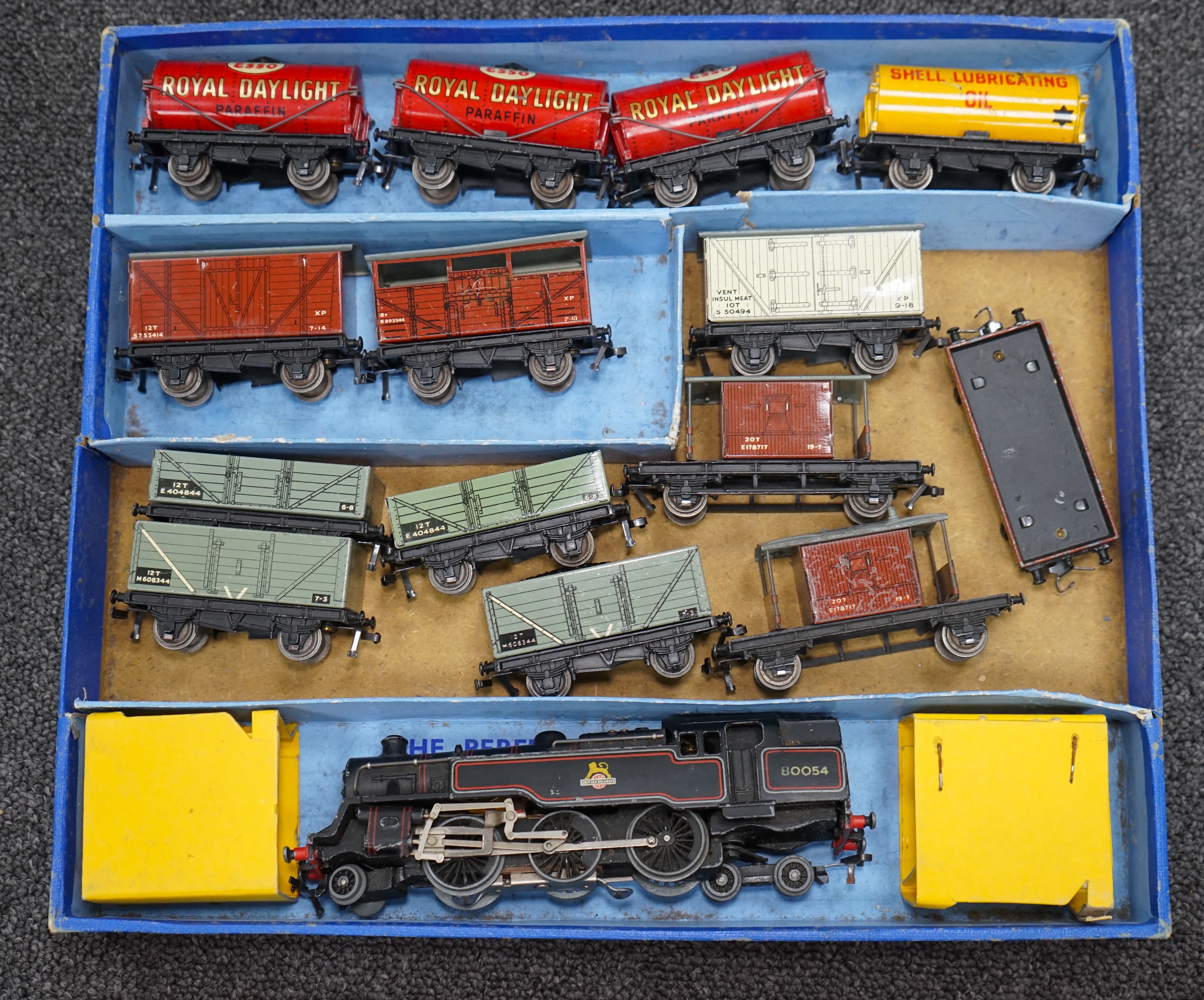 A collection of Hornby Dublo and Tri-ang Railways 00 gauge railway contained within two original boxes; a Hornby Dublo EDG17 Tank Goods Train B.R. set, contents include a BR Standard Class 4, 80054, fourteen tinplate fre